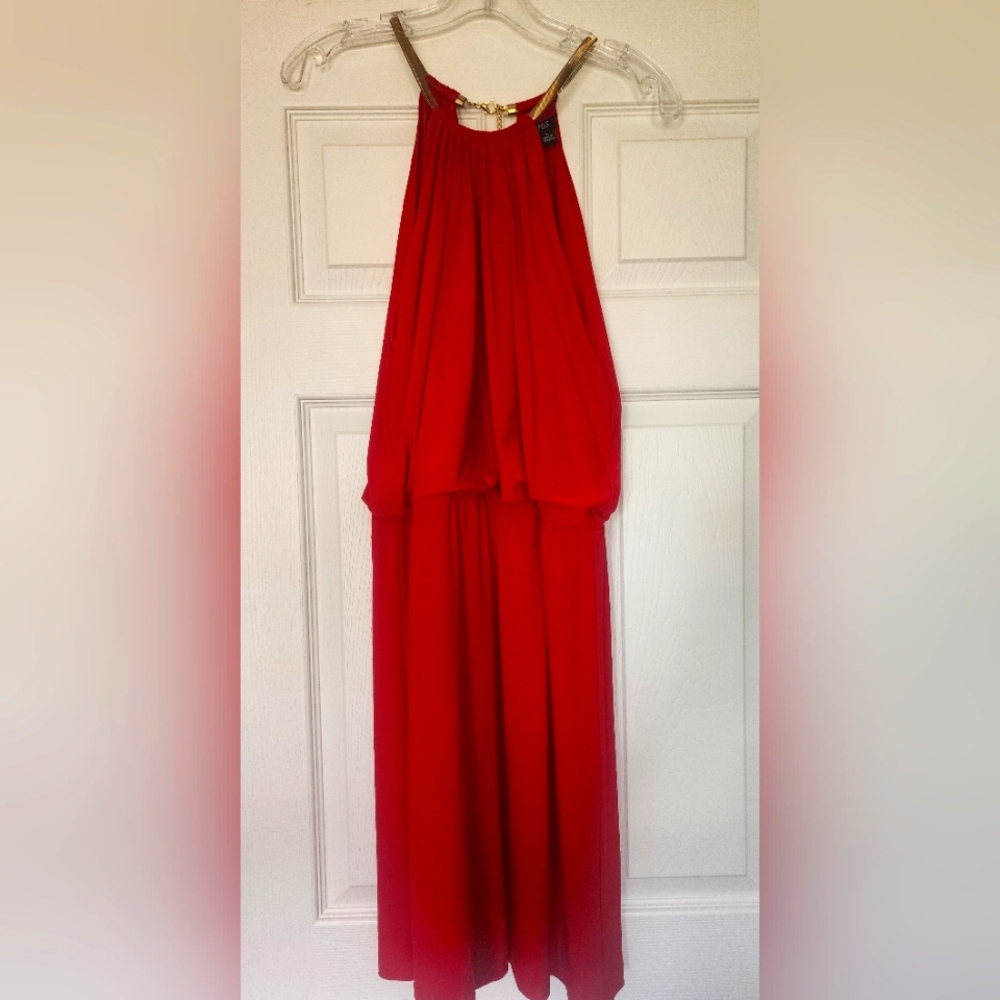 Red mini dress with gold chain details around shoulders and neck